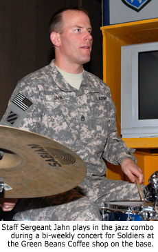 Staff Sergeant Jahn plays in the jazz combo during a bi-weekly concert for Soldiers at the Green Beans Coffee shop on the base.