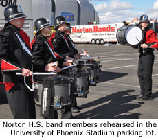 Norton H.S. band members rehearsed in the University of Phoenix Stadium parking lot.