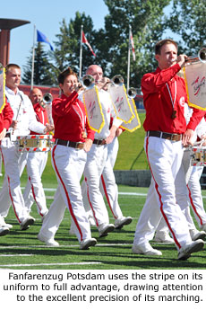 Fanfarenzug Potsdam uses the stripe on its uniform to full advantage, drawing attention to the excellent precision of its marching. Photo by Marching.com