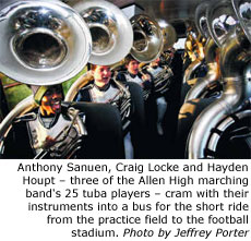 Anthony Sanuen, Craig Locke and Hayden Houpt, three of the Allen High marching band's 25 tuba players, cram with their instruments into a bus for the short ride from the practice field to the football stadium.