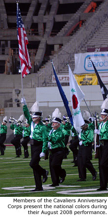 Members of the Cavaliers Anniversary Corps present the national colors during their August 2008 performance.