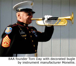 BAA founder Tom Day with decorated bugle by instrument manufacturer Monette.