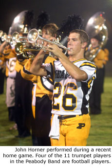 John Horner performed during a recent home game. Four of the 11 trumpet players in the Peabody Band are football players.